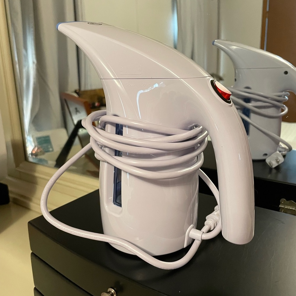 Like new garment steamer. Used once. hasbrush attachments. Distilled water rec.
